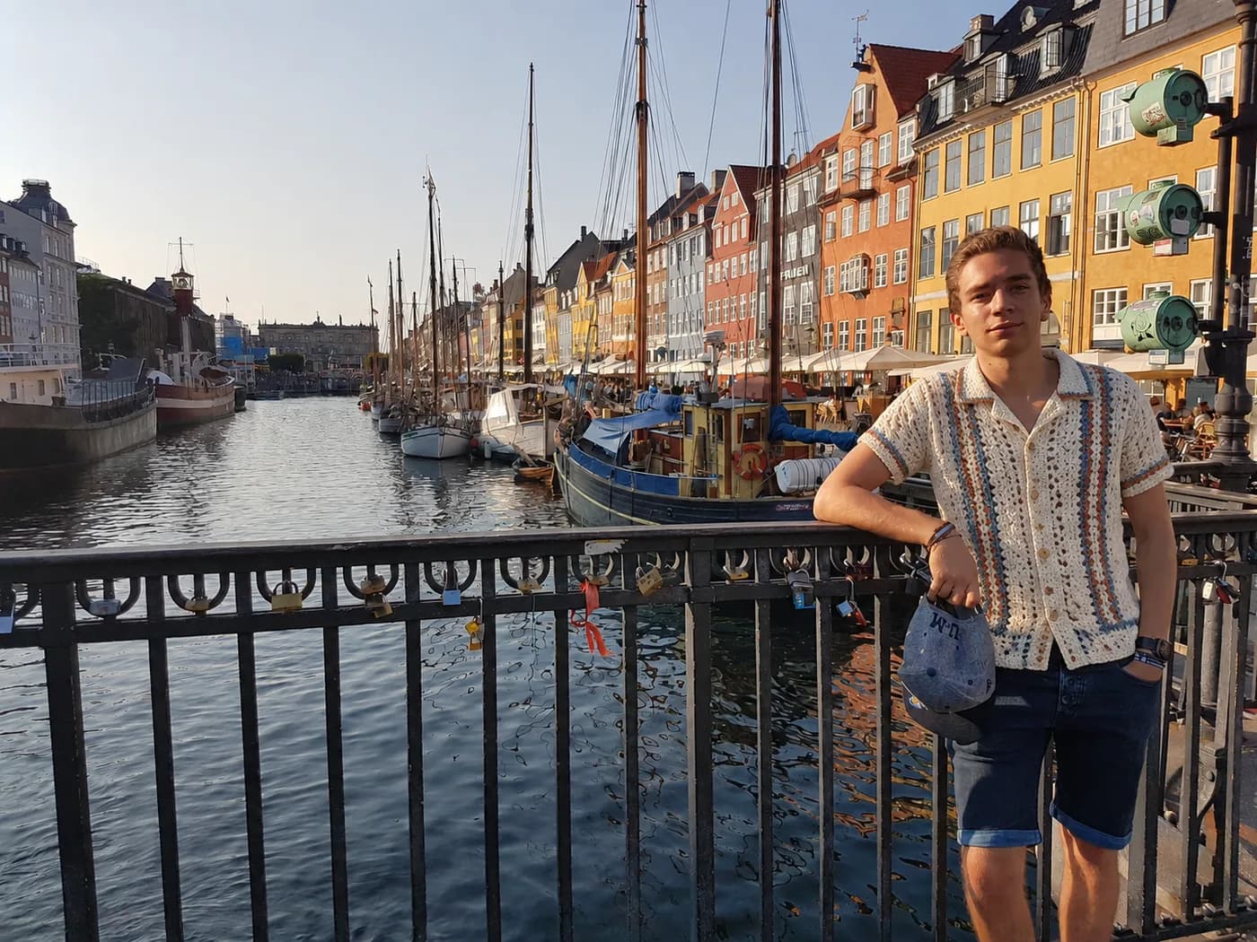 Lightweight crochet camp shirt by a sunny Aegean harbour