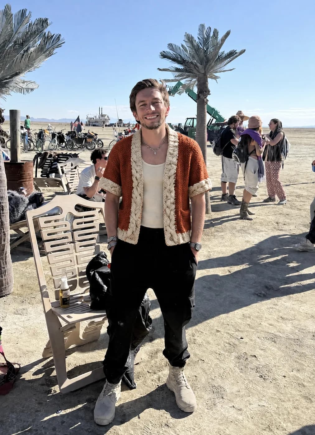 Terracotta hand-knit short-sleeve cable cardigan by the sea